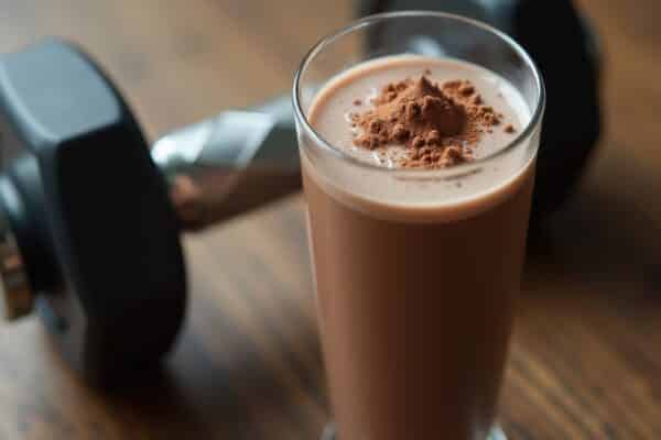 Picture of a chocolate drink and a large exercise weight