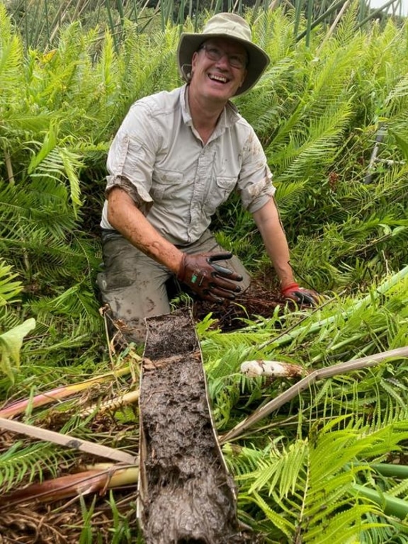 Professor David Sear with mud extracted from swampland in French Polynesia.