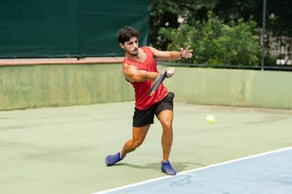 Tennis player hits a groundstroke during a match