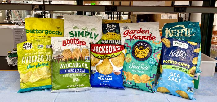 a pic of chips lined on counter,  among the 54 avocado-labeled products tested for avocado oil authenticity in the Wang lab at UC Davis.