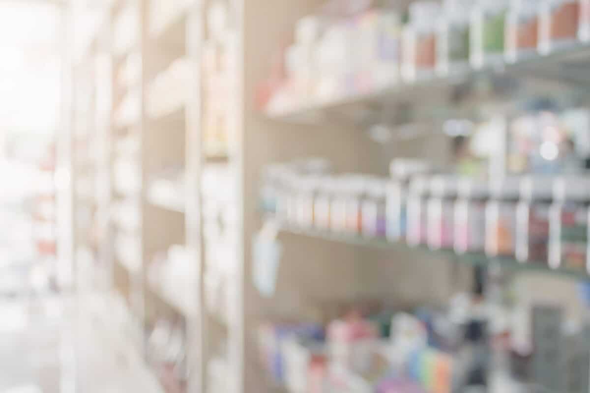 Pharmacy blur background with medicine on shelves