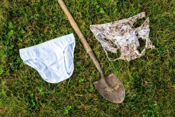 After being buried in the ground for two months and broken down by soil organisms, a new pair of cotton underwear (left) shows clear signs of decomposition (right).