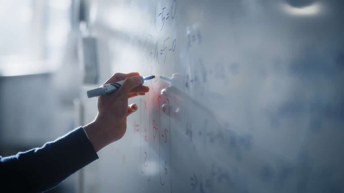 Macro Shot of a Blue Marker Pen Being Held with a Hand. Teacher