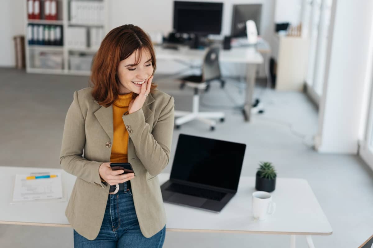 Young businesswoman chuckling to herself
