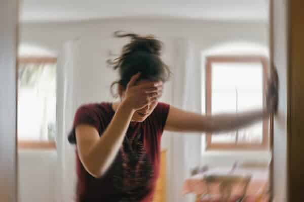 Woman suffering a stroke, migraine headache, or vertigo