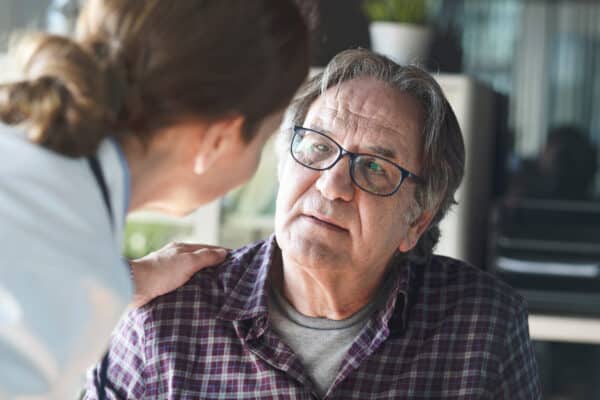 Doctor talking with senior patient